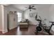 Sitting room with hardwood floors, exercise bike, comfortable chair, and natural light from a window at 4965 Skyland Pkwy, Cumming, GA 30028
