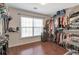 Walk-in closet with ample storage, shelving, and racks for clothing, plus a window for natural light at 4965 Skyland Pkwy, Cumming, GA 30028