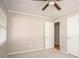 Bedroom with carpet, a closet, and doorway to another room, offering ample storage and easy access at 879 Rock Oak Ln, Lawrenceville, GA 30046