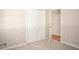 Bedroom with carpet, a closet, and doorway to another room, offering ample storage and easy access at 879 Rock Oak Ln, Lawrenceville, GA 30046
