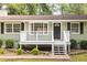 Close-up of the home's inviting porch and black front door at 879 Rock Oak Ln, Lawrenceville, GA 30046