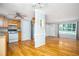 Open floor plan from kitchen, showing cabinets, appliances, hardwood floors, and a window at 879 Rock Oak Ln, Lawrenceville, GA 30046