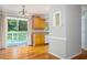 View of kitchen with wood cabinets, and a sliding glass door to outdoor deck at 879 Rock Oak Ln, Lawrenceville, GA 30046
