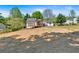 Spacious backyard with deck and charming white exterior of the home at 144 Cathy Ln, Hiram, GA 30141