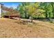 Spacious backyard featuring a deck and shed, with plenty of potential at 144 Cathy Ln, Hiram, GA 30141