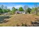 Wide backyard featuring a home with a rear deck and white exterior at 144 Cathy Ln, Hiram, GA 30141