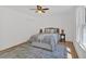 Bright bedroom with neutral tones, large windows and views to the outdoors at 144 Cathy Ln, Hiram, GA 30141