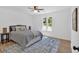 Cozy bedroom featuring a ceiling fan, natural light, and modern decor at 144 Cathy Ln, Hiram, GA 30141
