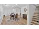 Open dining area with laminate flooring, stairs and stylish decor for cozy gatherings at 144 Cathy Ln, Hiram, GA 30141