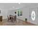 Sunlit dining room features modern decor and laminate floors, perfect for Gathering meals at 144 Cathy Ln, Hiram, GA 30141