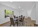 Bright dining space with natural light, modern furnishings, and laminate floors at 144 Cathy Ln, Hiram, GA 30141