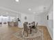 Open concept dining room with laminate floors and an area rug flows to the kitchen at 144 Cathy Ln, Hiram, GA 30141