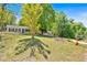 Charming single-story home with black shutters, nestled on a lush green lot with mature trees at 144 Cathy Ln, Hiram, GA 30141