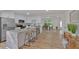 Spacious open kitchen with island, laminate floors, white cabinetry and stainless appliances at 144 Cathy Ln, Hiram, GA 30141