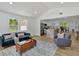 Spacious living room showcases natural light, and an open floorplan with kitchen and dining areas at 144 Cathy Ln, Hiram, GA 30141