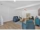 Bright living room features modern furniture, wood flooring, and natural light at 144 Cathy Ln, Hiram, GA 30141