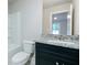Bathroom featuring a vanity with granite countertop, toilet and bathtub at 247 Lotus Ln, Covington, GA 30016