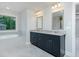 Elegant bathroom features a soaking tub and granite-topped double vanity at 247 Lotus Ln, Covington, GA 30016