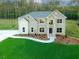 Newly built home with a lush green lawn and an inviting exterior at 247 Lotus Ln, Covington, GA 30016