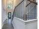 Elegant foyer with staircase, chandelier, and a decorative front door at 247 Lotus Ln, Covington, GA 30016
