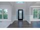 Spacious foyer with a decorative front door and natural light at 247 Lotus Ln, Covington, GA 30016