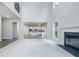 Bright and spacious living room open to the kitchen area with modern fireplace at 247 Lotus Ln, Covington, GA 30016