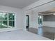 Bright living room with large windows, carpet and hardwood floors at 247 Lotus Ln, Covington, GA 30016