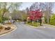 Gated community entrance with well-maintained landscaping, offering security and curb appeal at 2700 Ridge Run Tr Trl, Duluth, GA 30097
