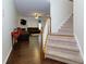 Open floor plan featuring hardwood floors, staircase, and a bright living room with access to the upper floor at 2700 Ridge Run Tr Trl, Duluth, GA 30097