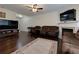 Cozy living room with fireplace, hardwood floors, comfortable seating, and entertainment center, perfect for gatherings at 2700 Ridge Run Tr Trl, Duluth, GA 30097