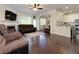 Spacious living area featuring hardwood floors, a fireplace, and an open layout to the dining area at 2700 Ridge Run Tr Trl, Duluth, GA 30097