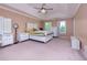 Spacious main bedroom with a tray ceiling, natural light, and a comfortable layout at 2700 Ridge Run Tr Trl, Duluth, GA 30097
