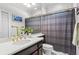 Bathroom featuring a sink, gold fixtures and a shower with gray curtain at 300 Brayward Chase, Roswell, GA 30076