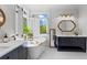 Bright bathroom with double vanity, free-standing tub, modern fixtures and a large window with shuttered blinds at 300 Brayward Chase, Roswell, GA 30076
