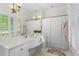 Bright bathroom with a large mirror, white vanity and a shower with a white curtain at 300 Brayward Chase, Roswell, GA 30076