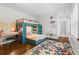 Bedroom featuring a unique bunkbed design, a desk, and a hardwood floor at 300 Brayward Chase, Roswell, GA 30076
