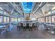 Bright clubhouse interior with vaulted ceilings, a full bar, ample seating, and a cozy fireplace, perfect for social gatherings at 300 Brayward Chase, Roswell, GA 30076