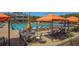 Outdoor pool area featuring lounge chairs, umbrellas, and a well-maintained deck, showcasing a relaxing community amenity at 300 Brayward Chase, Roswell, GA 30076