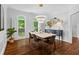 Stylish dining room with modern chandelier, elegant table setting, and bright natural light at 300 Brayward Chase, Roswell, GA 30076