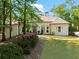 Stunning single-story home with manicured lawn, lush landscaping, and inviting entrance at 300 Brayward Chase, Roswell, GA 30076