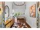 Inviting home foyer with hardwood floors, decorative lighting, and open living area at 300 Brayward Chase, Roswell, GA 30076