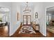 Gracious foyer featuring hardwood floors, elegant lighting, and a view to the front door at 300 Brayward Chase, Roswell, GA 30076