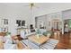 Spacious living room with hardwood floors, comfortable seating, and a view to the foyer at 300 Brayward Chase, Roswell, GA 30076