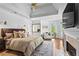 Spacious main bedroom with tray ceilings, a fireplace, sitting area, and hardwood floors at 300 Brayward Chase, Roswell, GA 30076