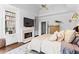 Cozy main bedroom with a fireplace, built-in bookshelves, and hardwood floors at 300 Brayward Chase, Roswell, GA 30076