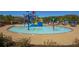 A vibrant community waterpark featuring a splash pad with slides, colorful play structures, and plenty of seating around the pool at 300 Brayward Chase, Roswell, GA 30076
