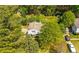 Aerial view of a home showcasing lush landscaping and a multi-car driveway at 6500 Chickasaw Dr, Douglasville, GA 30135