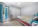 Cozy bedroom with a door to the balcony and with carpet floors, good natural light at 6500 Chickasaw Dr, Douglasville, GA 30135