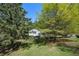 View of home through a variety of different trees creating a tranquil and private setting at 6500 Chickasaw Dr, Douglasville, GA 30135