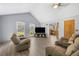 Bright living room showcasing hardwood floors, neutral walls, and open kitchen access at 6500 Chickasaw Dr, Douglasville, GA 30135